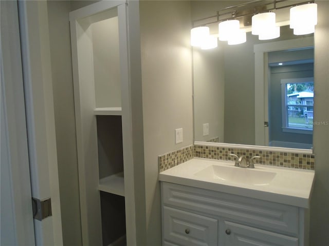 bathroom with backsplash and vanity