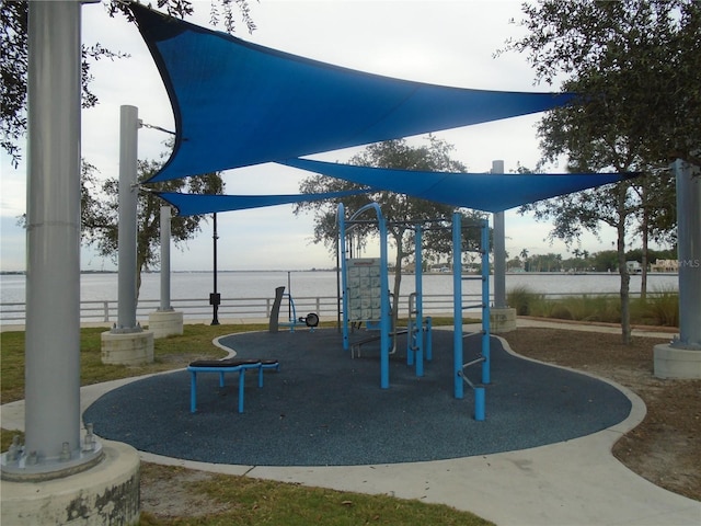 view of jungle gym with a water view