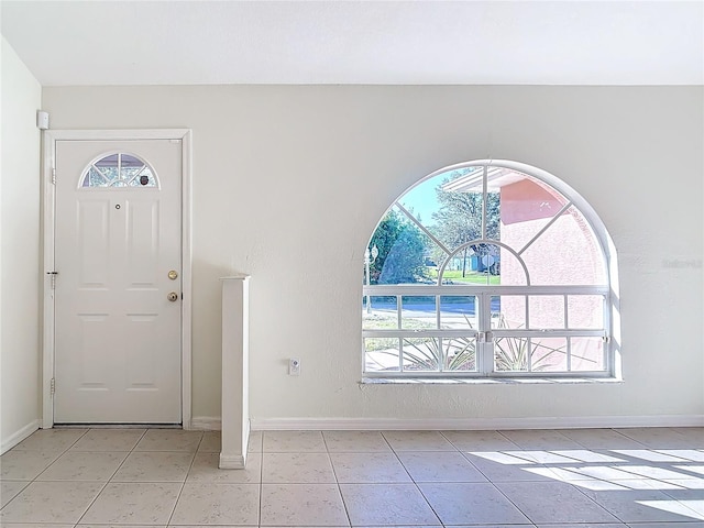 entrance foyer featuring light tile patterned floors