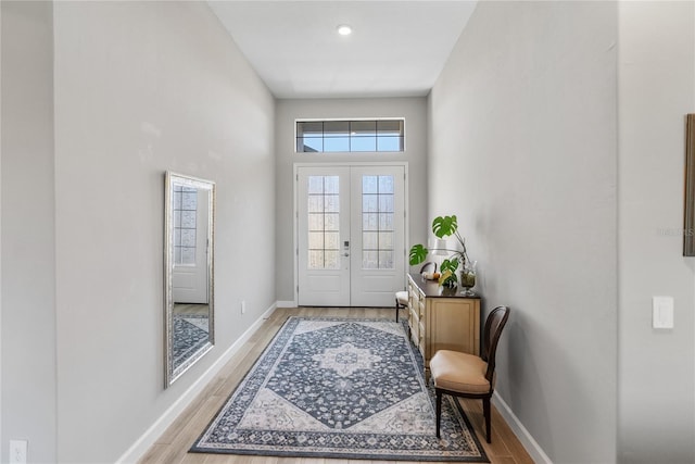 doorway featuring french doors and light hardwood / wood-style flooring