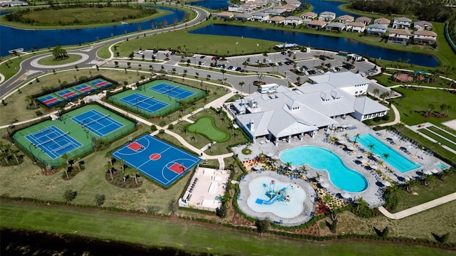 birds eye view of property with a residential view and a water view