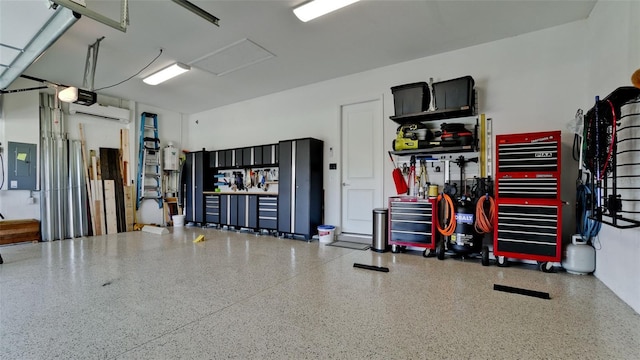 garage with electric panel and a workshop area