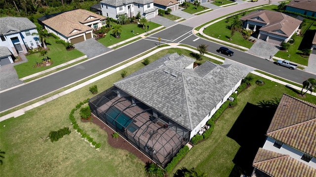 birds eye view of property with a residential view