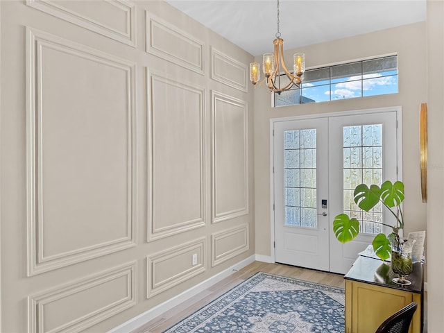 4906 Lighthouse Bay Ln, Bradenton, FL 34211 - entryway featuring a chandelier, light wood finished floors, and baseboards