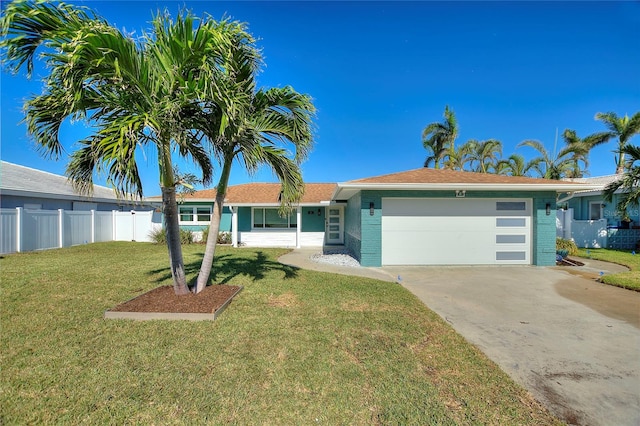 ranch-style house with a garage and a front lawn