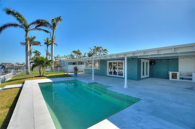 view of swimming pool featuring a patio area