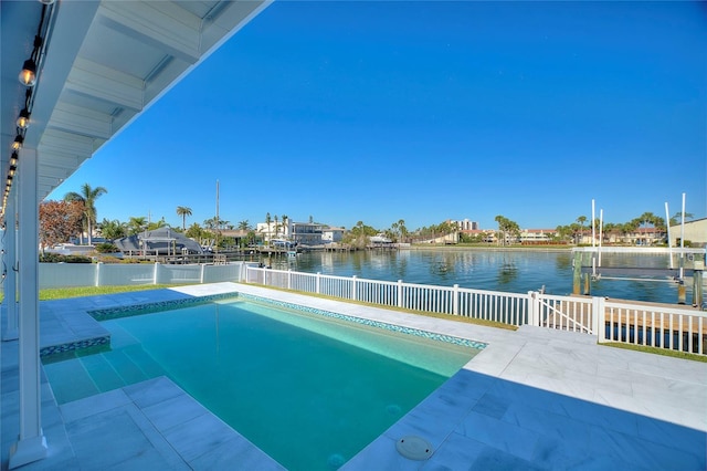 view of swimming pool featuring a water view, a dock, and a patio area