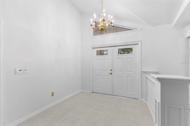 entryway featuring light tile patterned floors, an inviting chandelier, and lofted ceiling