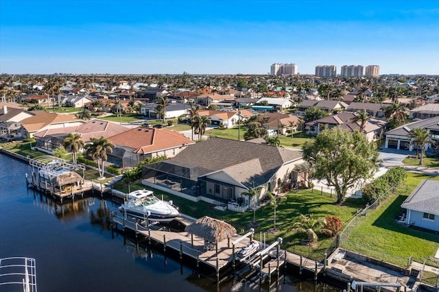 birds eye view of property featuring a water view