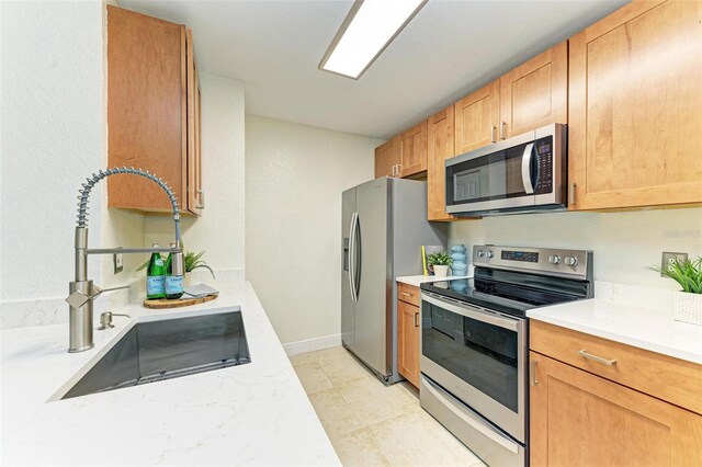 kitchen featuring stainless steel appliances and sink