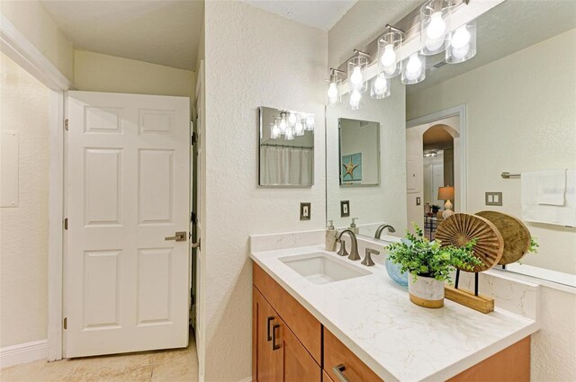 bathroom featuring tile patterned floors and vanity