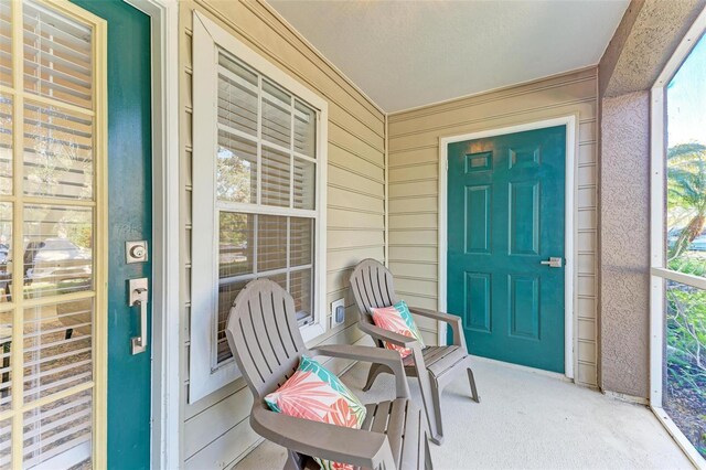 doorway to property with covered porch