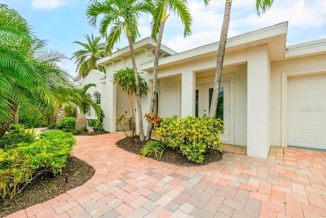 doorway to property featuring a garage