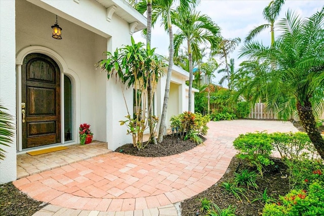 entrance to property featuring a patio