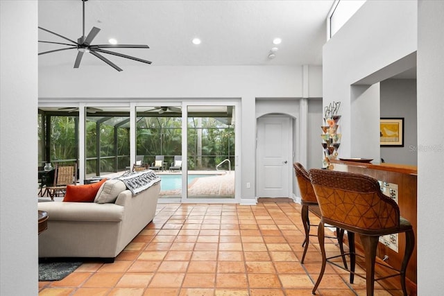 living room featuring plenty of natural light and a high ceiling