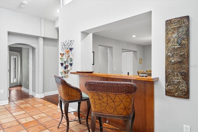 bar with light tile patterned floors