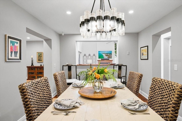 dining area with an inviting chandelier