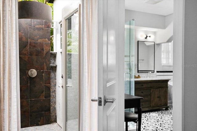 bathroom featuring an enclosed shower, vanity, and tile patterned floors