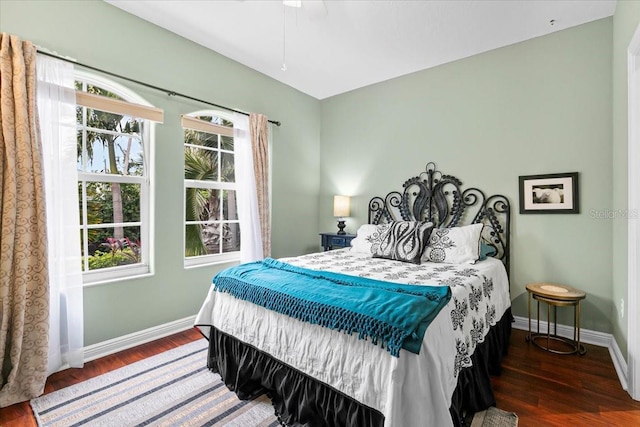 bedroom featuring ceiling fan and dark hardwood / wood-style floors