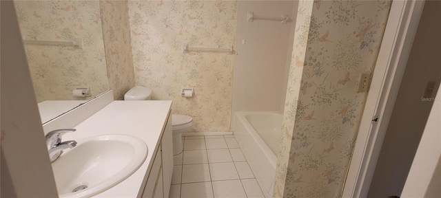 bathroom featuring toilet, vanity, and tile patterned floors