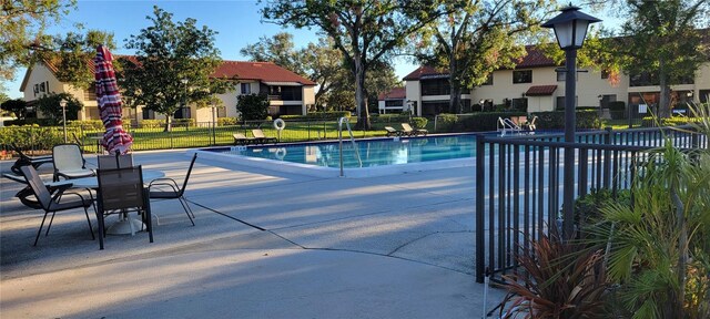 view of swimming pool with a patio area