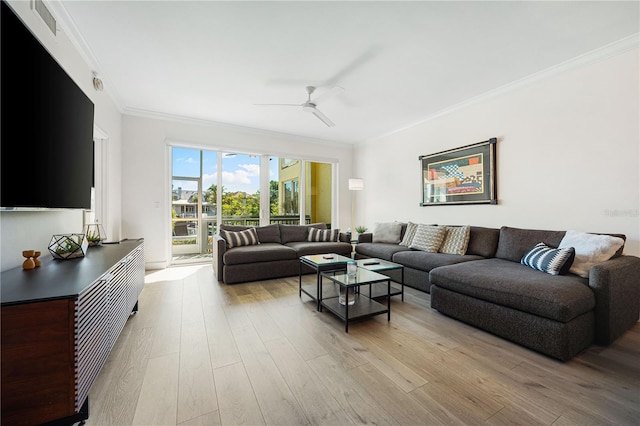 living room featuring ceiling fan, crown molding, and light hardwood / wood-style floors