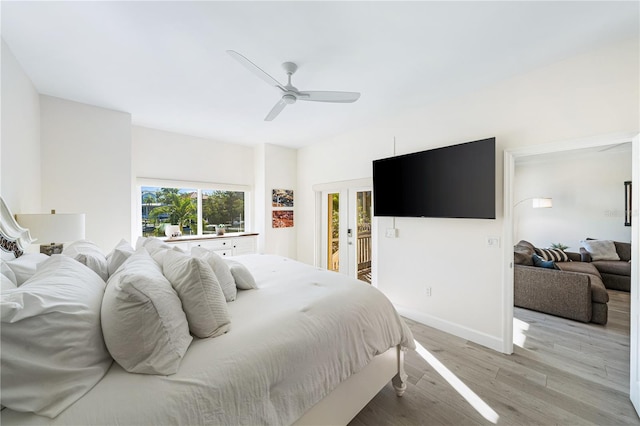 bedroom featuring ceiling fan, access to exterior, and light hardwood / wood-style flooring