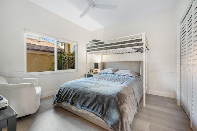 bedroom with ceiling fan and light hardwood / wood-style flooring