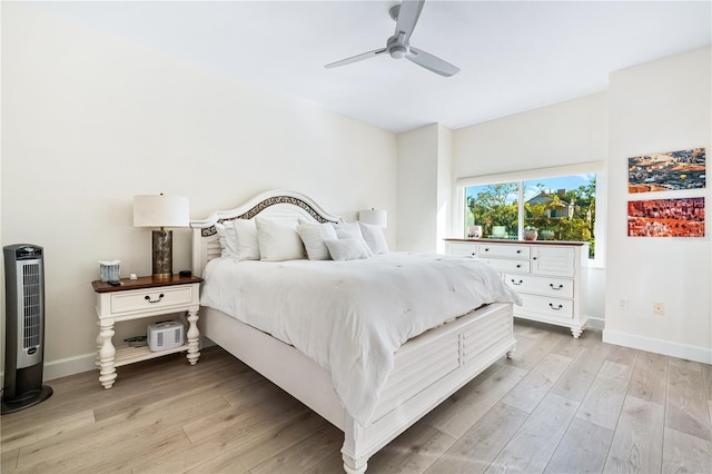 bedroom featuring ceiling fan and light hardwood / wood-style flooring