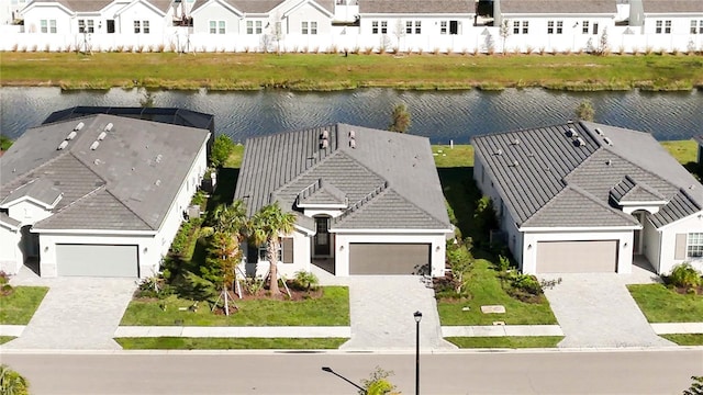 birds eye view of property featuring a water view