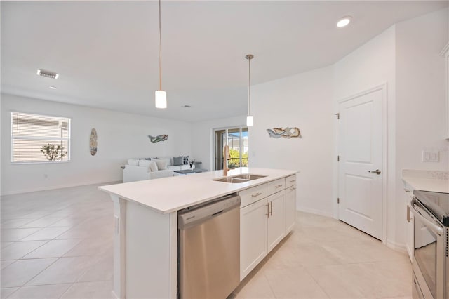 kitchen featuring white cabinetry, sink, hanging light fixtures, a center island with sink, and appliances with stainless steel finishes