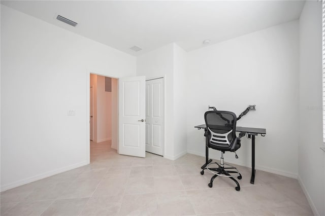 home office featuring light tile patterned floors