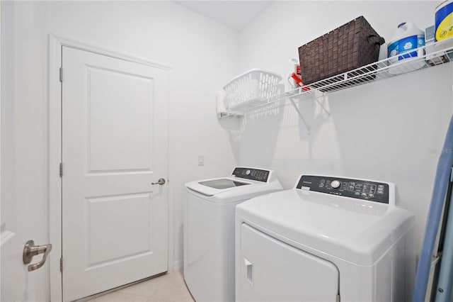 laundry room with washing machine and dryer