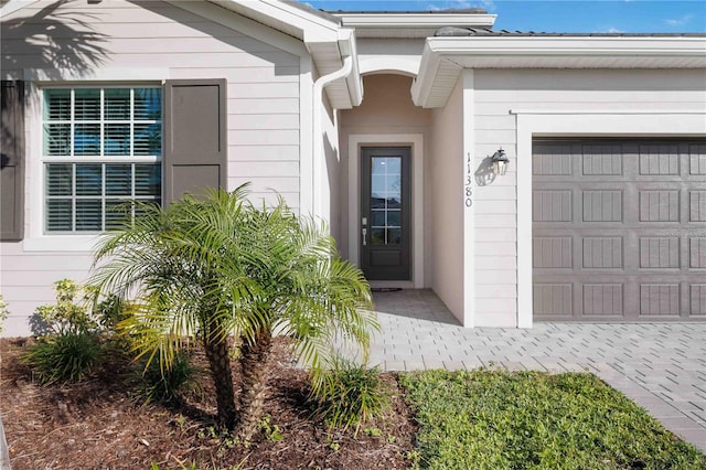 property entrance featuring a garage