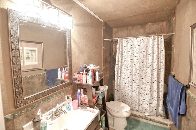 bathroom featuring curtained shower, vanity, ornamental molding, and toilet