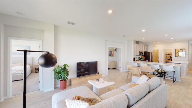 living room featuring light wood-type flooring