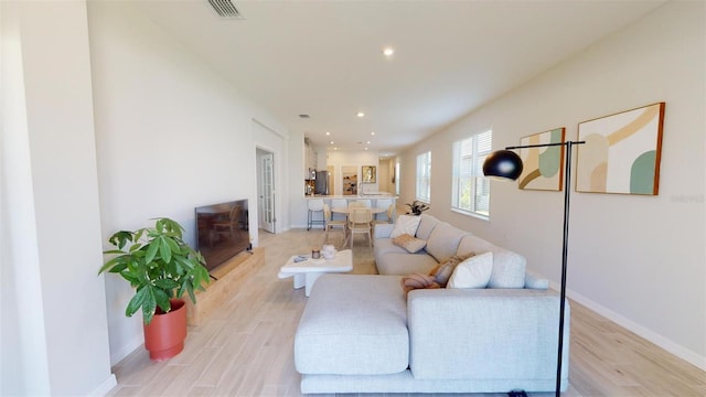 living room with light hardwood / wood-style floors