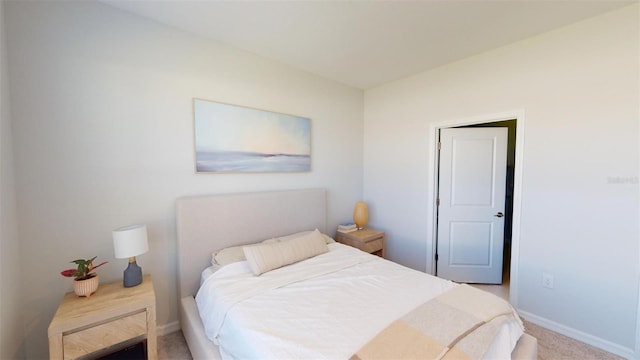 bedroom featuring light colored carpet