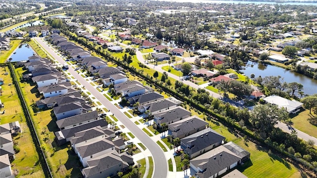 drone / aerial view with a water view