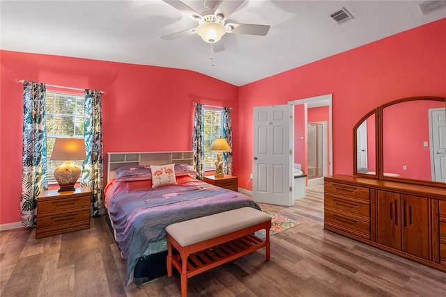 bedroom featuring hardwood / wood-style floors, vaulted ceiling, and ceiling fan