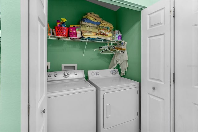 laundry area featuring washing machine and clothes dryer