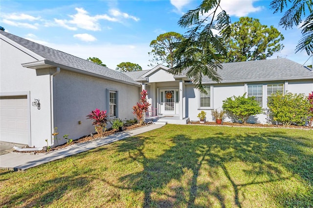 ranch-style home featuring a garage and a front lawn