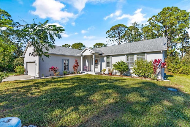 ranch-style house featuring a front yard and a garage