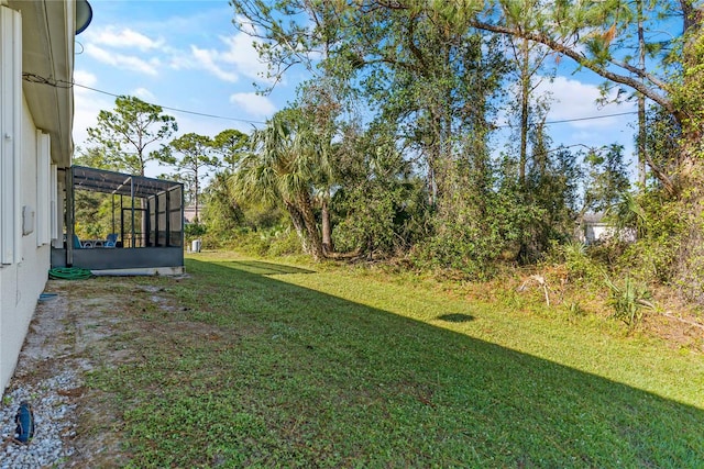 view of yard with a lanai