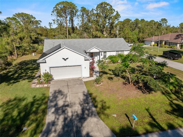 view of front of home with a front yard, solar panels, and a garage