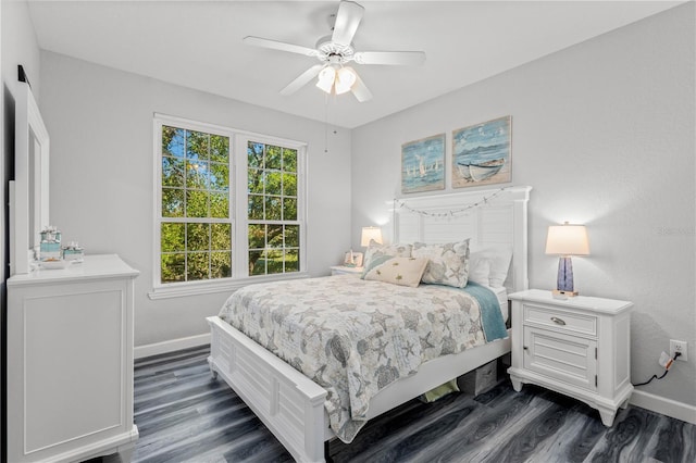 bedroom with ceiling fan and dark hardwood / wood-style flooring