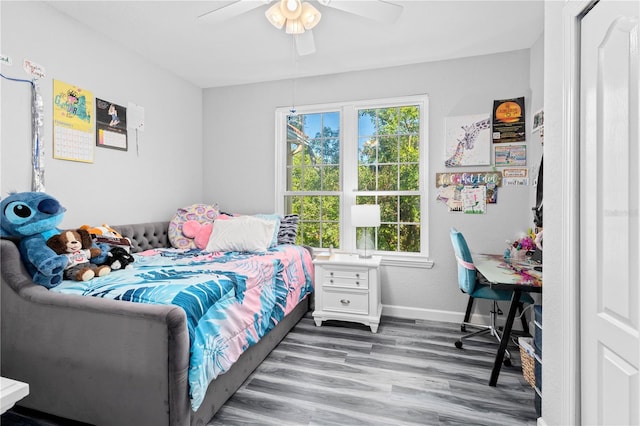 bedroom with hardwood / wood-style flooring and ceiling fan