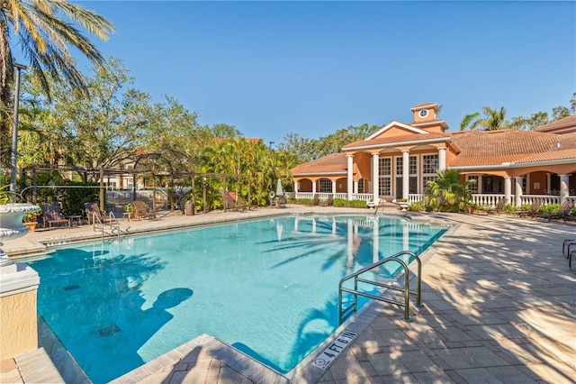 view of swimming pool featuring a patio