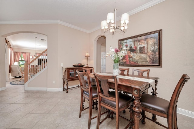 dining room featuring light tile patterned floors, a chandelier, and ornamental molding