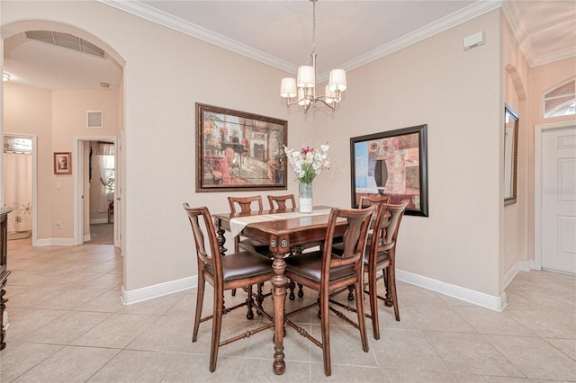 dining space with an inviting chandelier, ornamental molding, and light tile patterned flooring